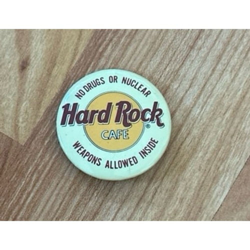 vintage Hard Rock Cafe pinback button with the text "NO DRUGS OR NUCLEAR WEAPONS